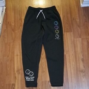 SmileyWorld Black Joggers. "Dont Know Where, But Together" Colourful Smiley Face